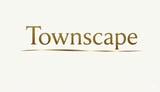 Townscape logo in gold lettering with decorative underline on cream background